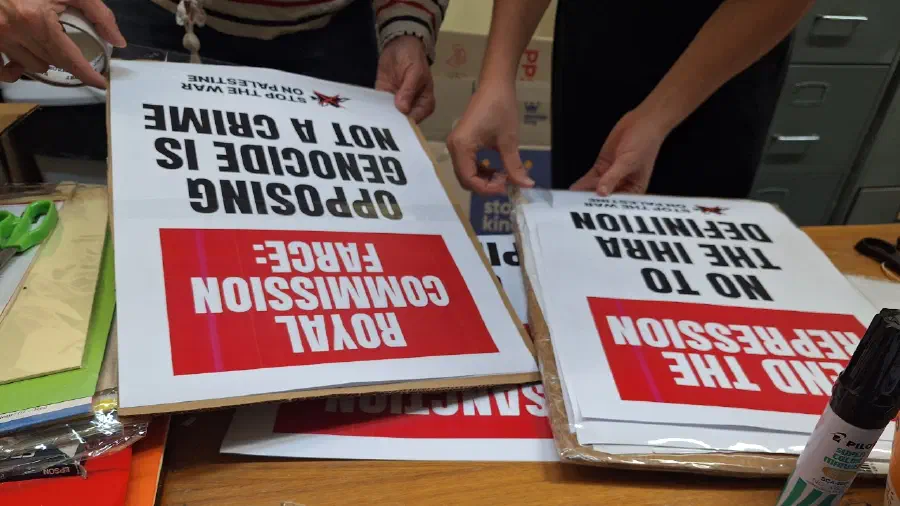 SWOP members create placards for a protest.