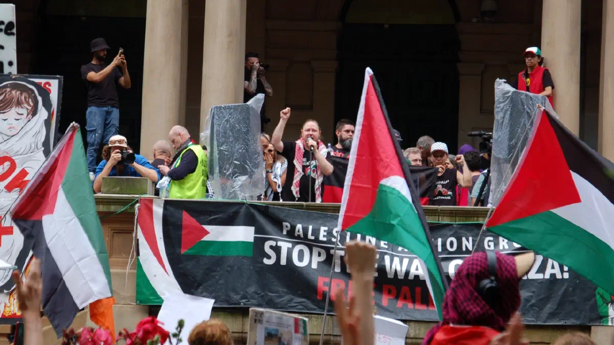 Palestine Action Group organiser Josh Lees addresses protestors outside Sydney Town Hall.