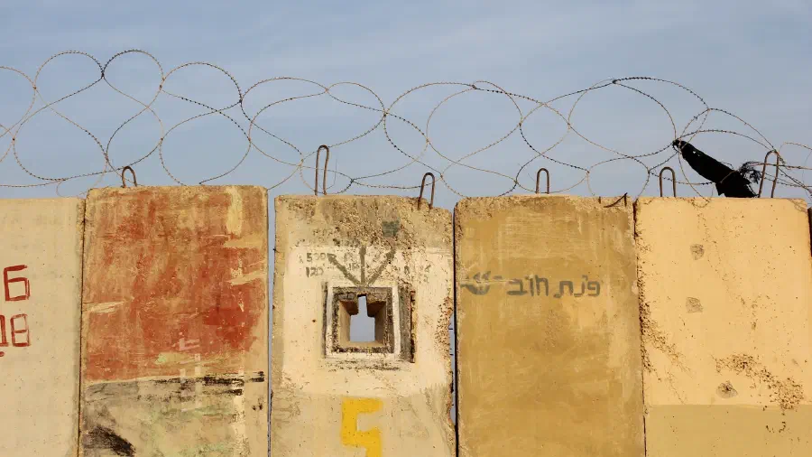 Razor wire across the top of the concrete wall that surrounds Gaza.