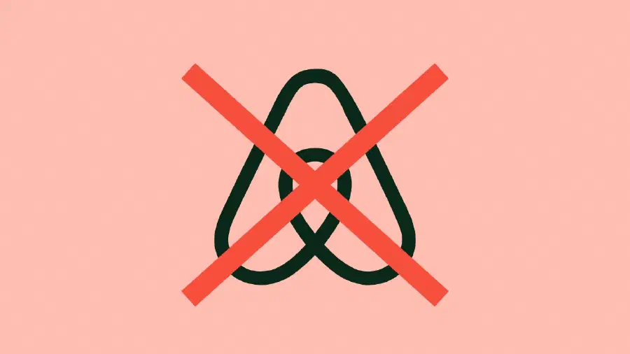 The Airbnb logo covered with a red cross.