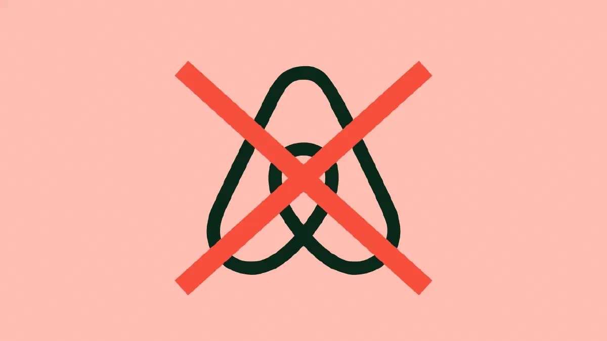 The Airbnb logo covered with a red cross.