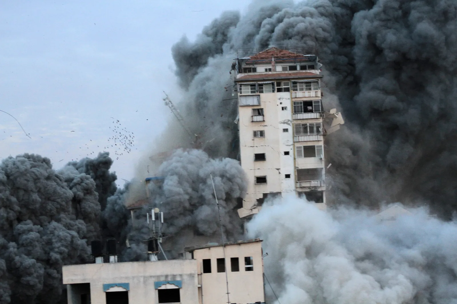 Smoke and flames billow from windows after Israeli forces struck a high-rise tower in Gaza City